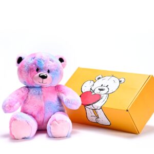 a stuffed teddy bear next to a box